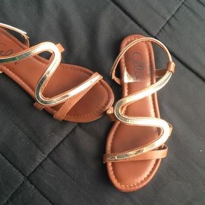 Brown and gold sandals